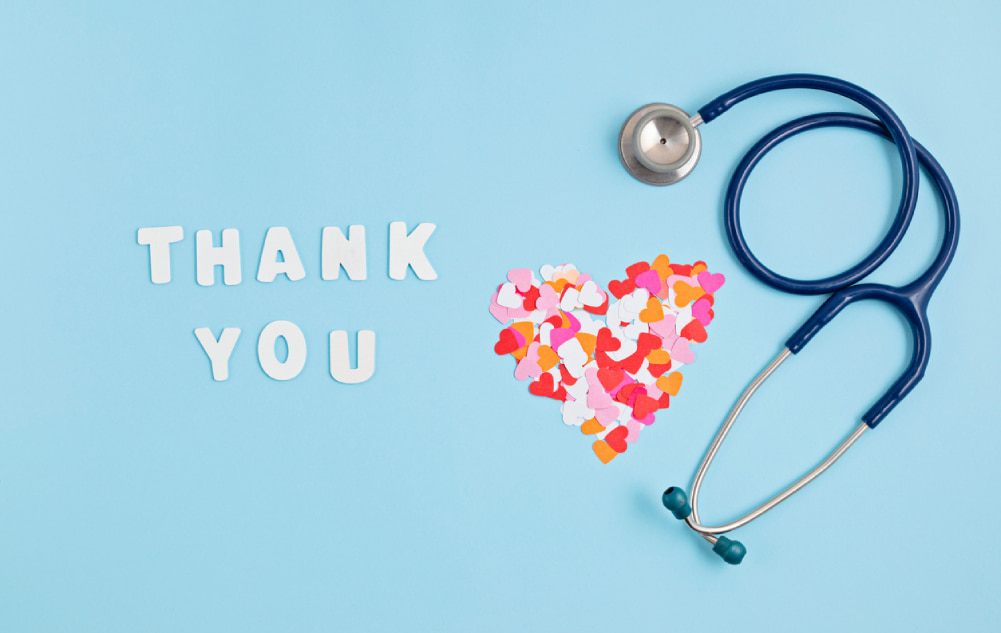 A heartwarming image celebrating the dedication of Total Senior Care home healthcare agency's employees, featuring hearts confetti, a stethoscope, and the appreciative message "Thank You."